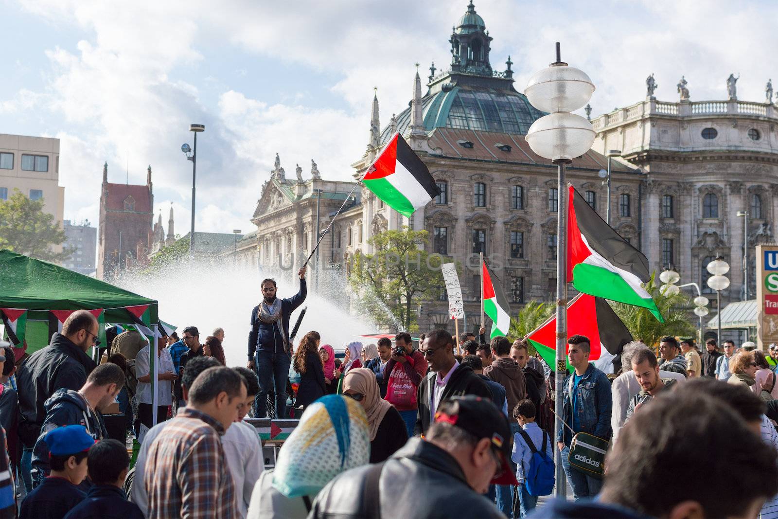 MUNICH, GERMANY - AUGUST 16, 2014: Anti-war meeting action in Europe. Pro-Palestinian activists calls from European Union government to take an active part in solving the Palestinian-Israeli conflict.