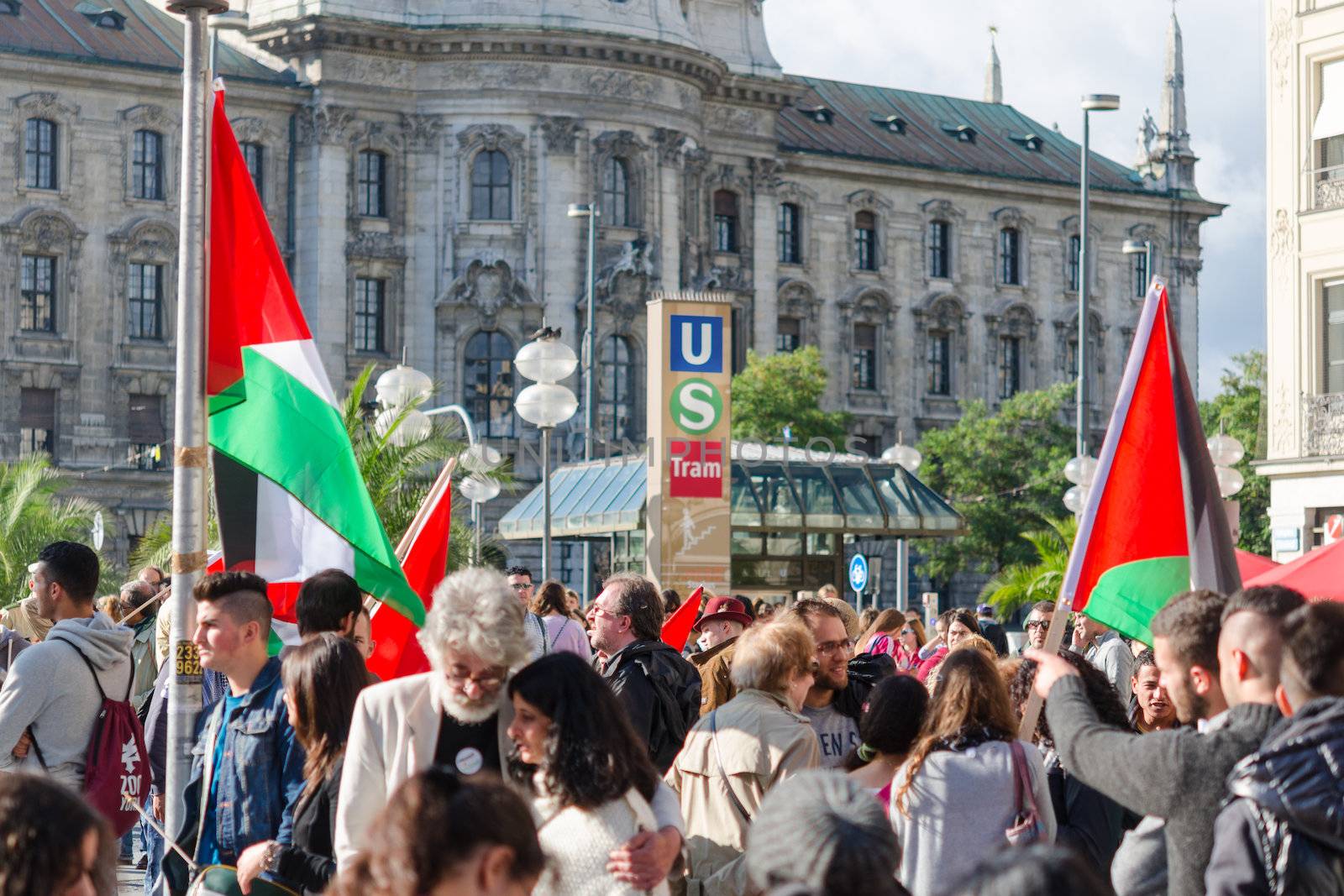 MUNICH, GERMANY - AUGUST 16, 2014: Pro-Palestinian activists at the demonstrations asking the Israeli government to stop the war in Gaza and to withdraw the armed forces from occupied territories.