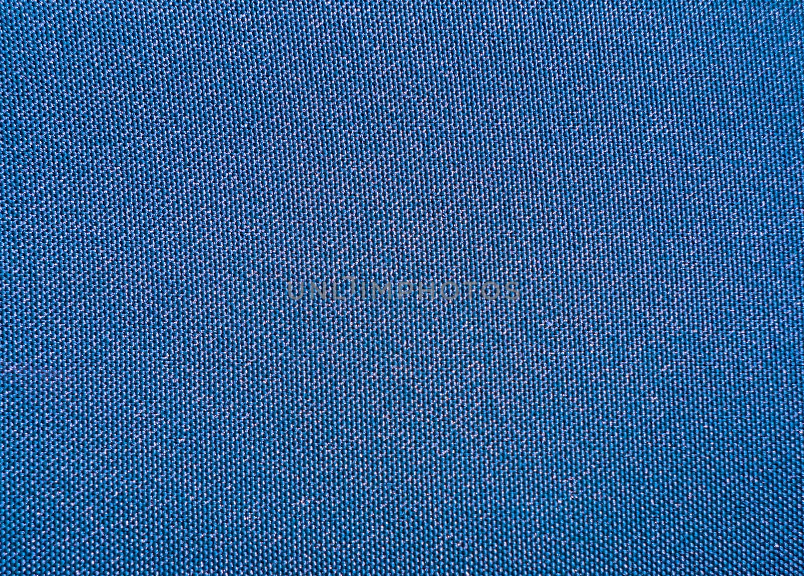Texture of a blue woven synthetic waterproof fabric closeup