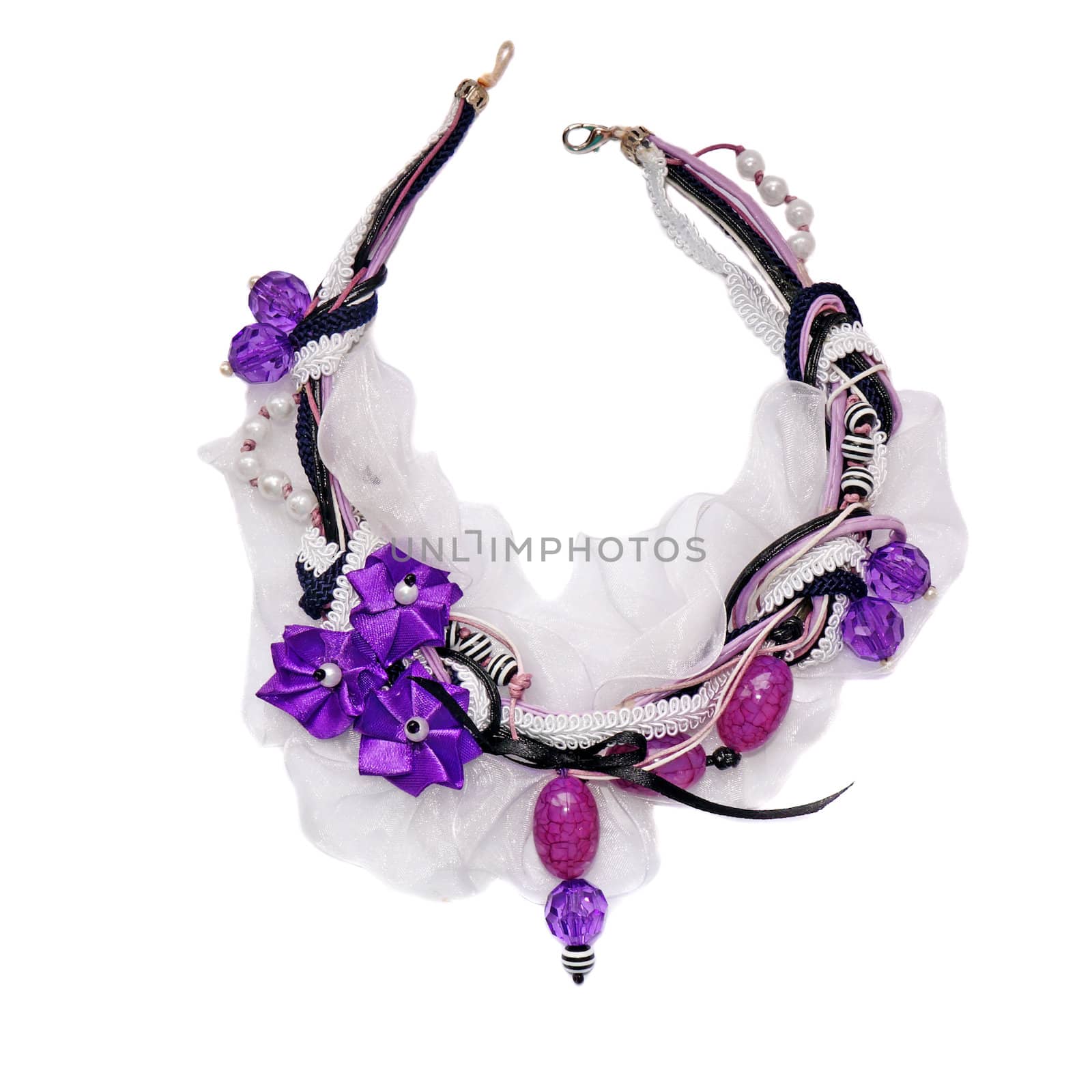   Vintage necklace decorated with beads, braid, laces and purple satin flowers                             