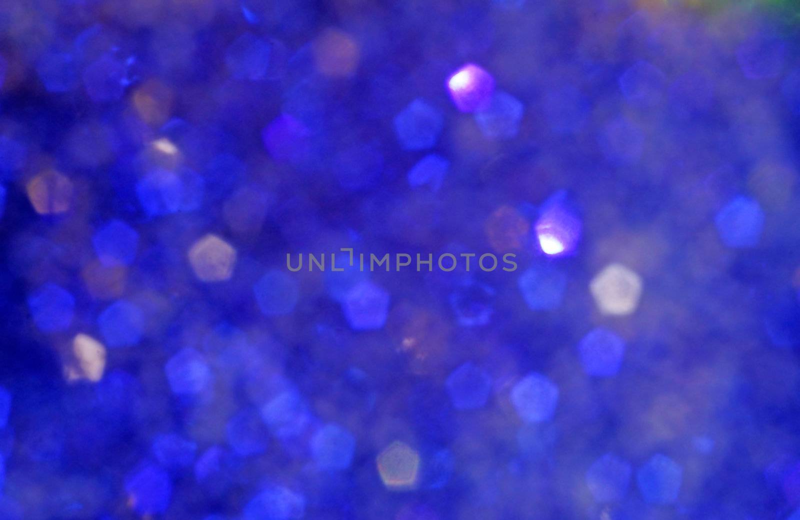 Blurry bright blue bokeh as background                               