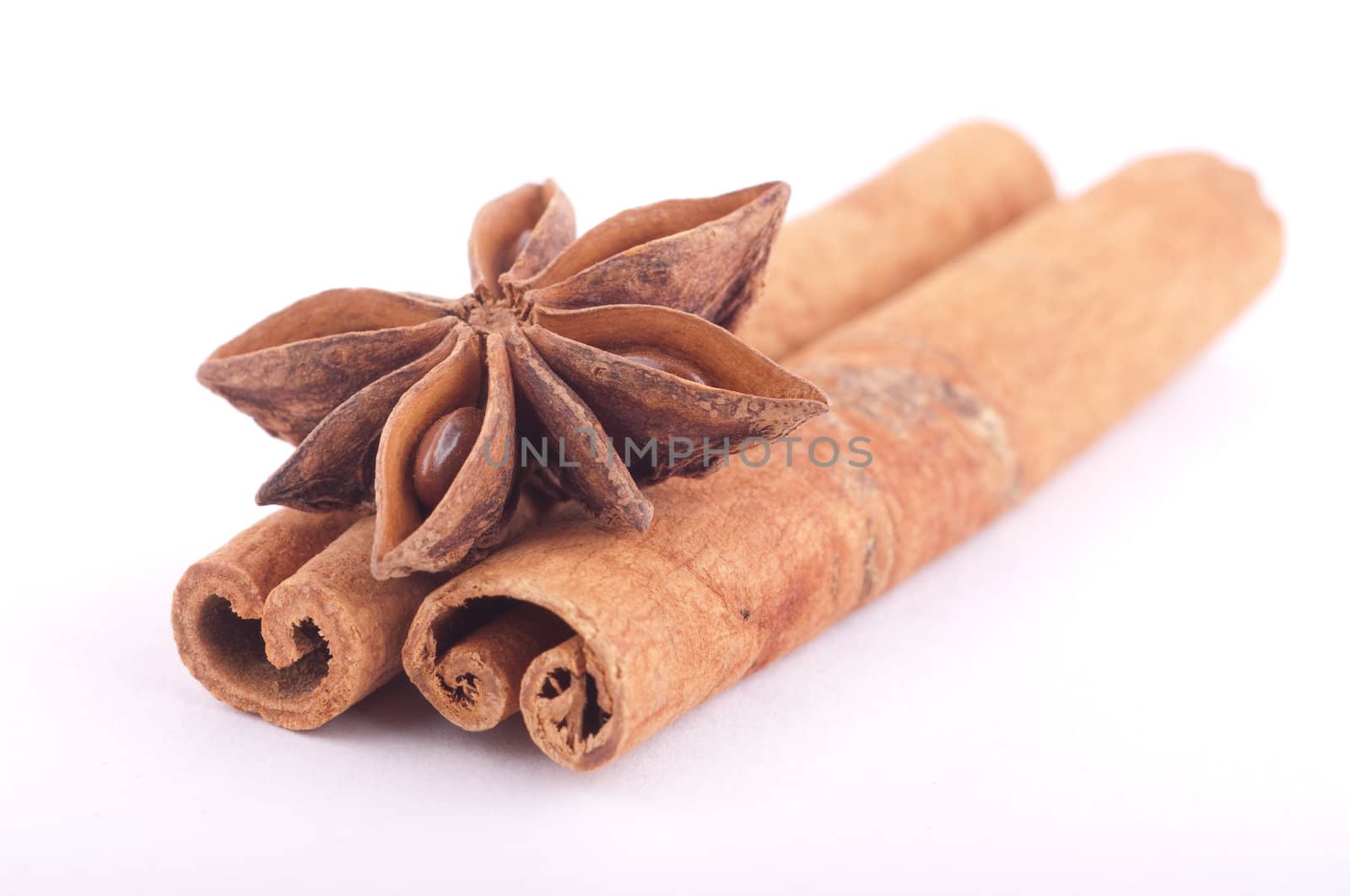 star anise with cinnamon sticks isolated on white by Rainman