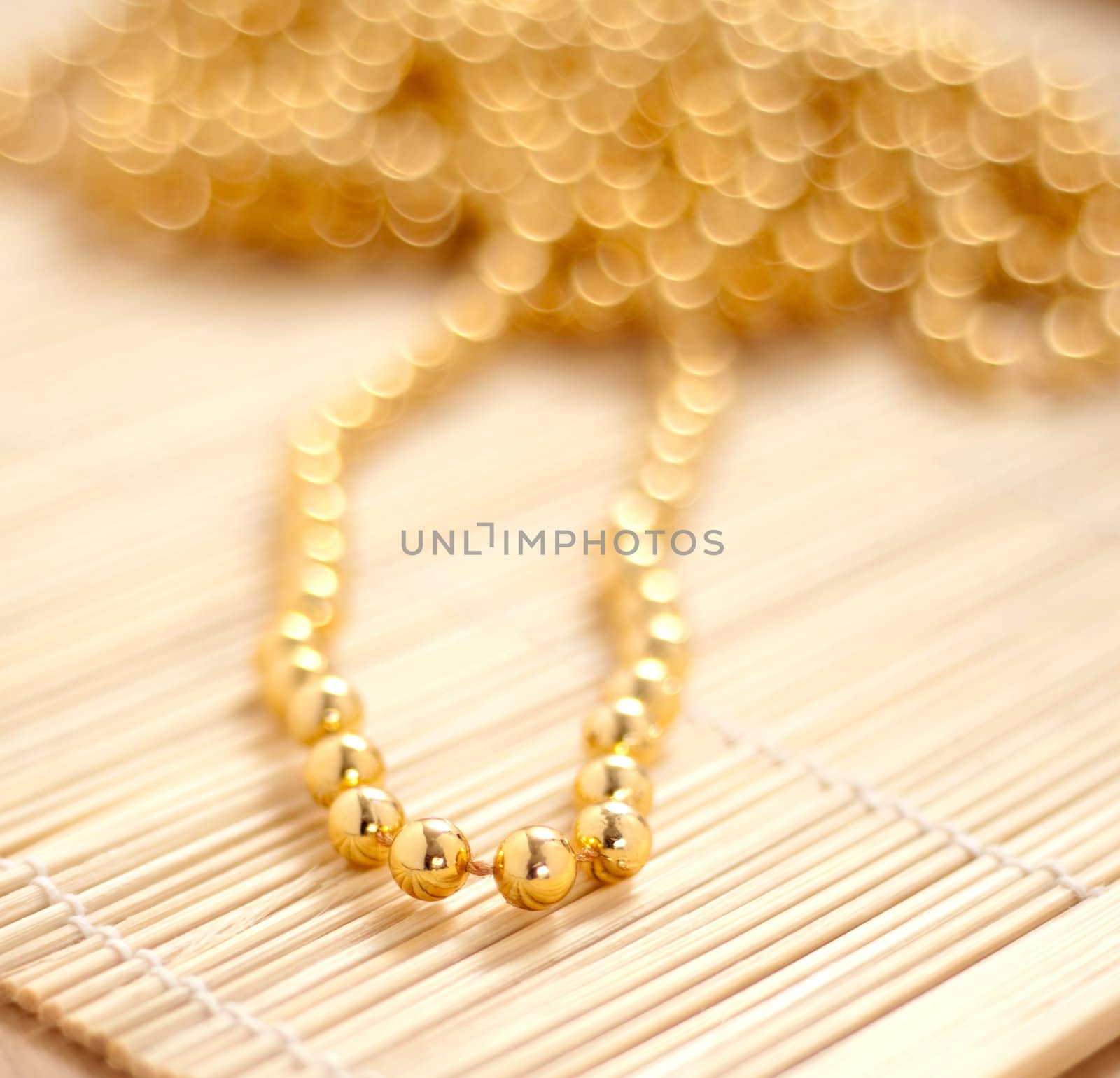 Gold pearls with extremely shallow depth of field