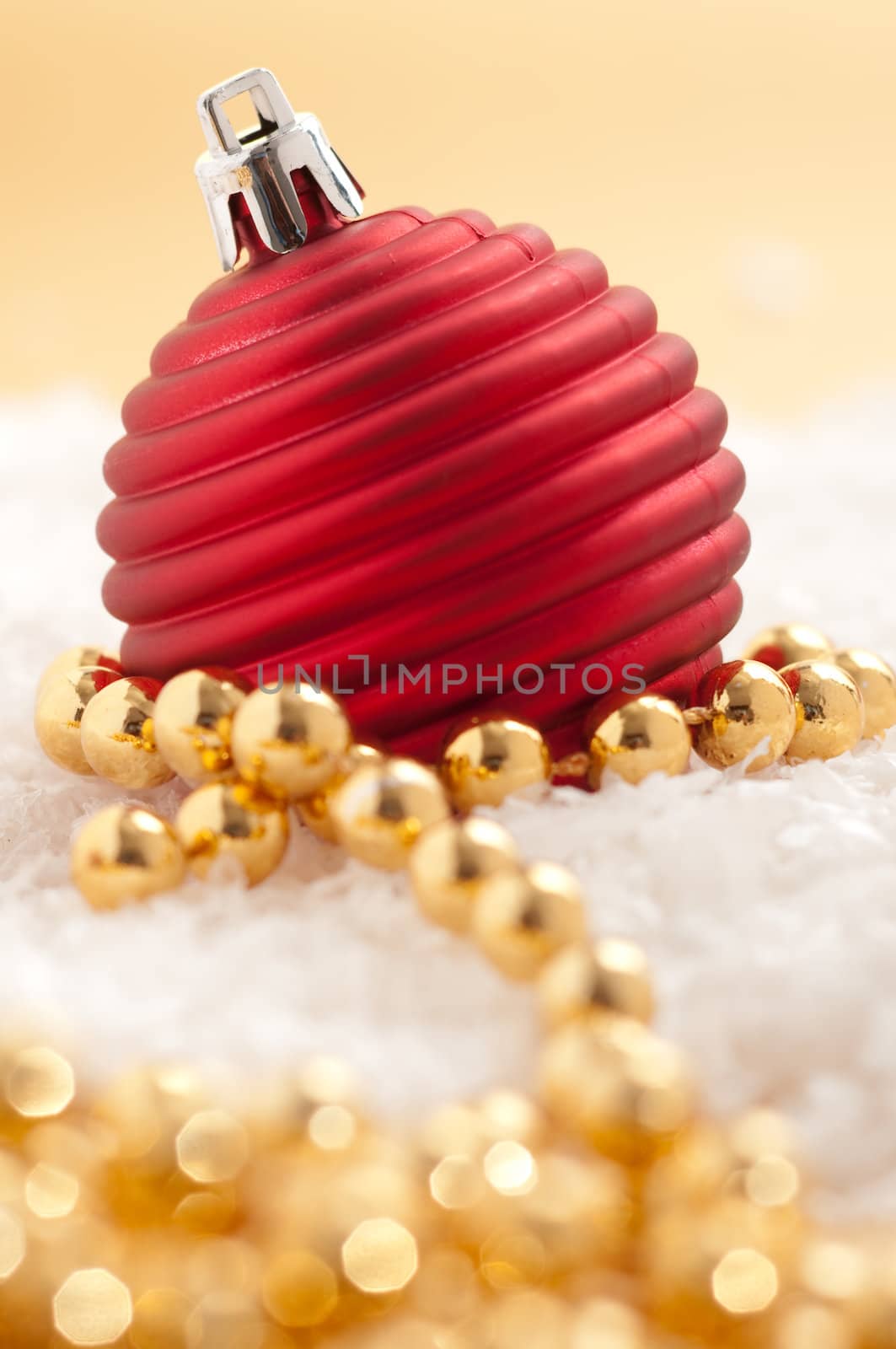 Red christmas ornament with gold pearls