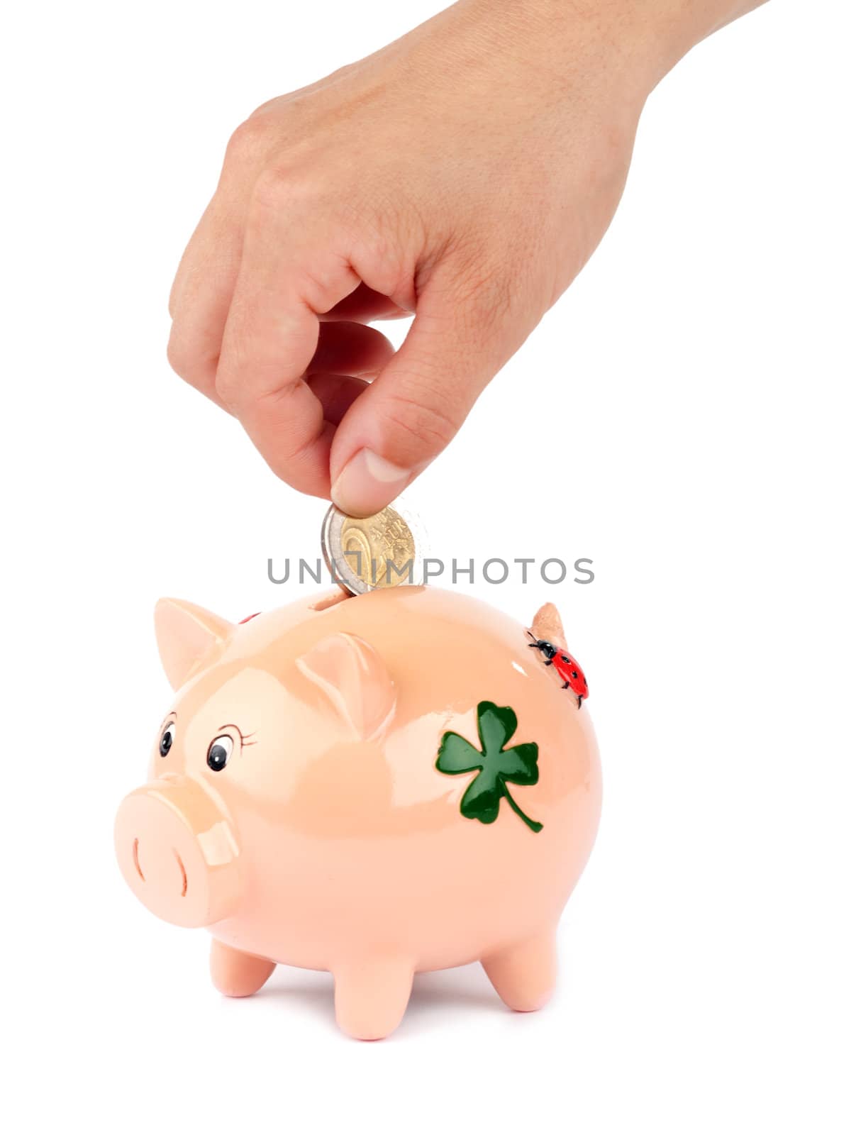 Woman putting coin in piggy bank isolated on white
