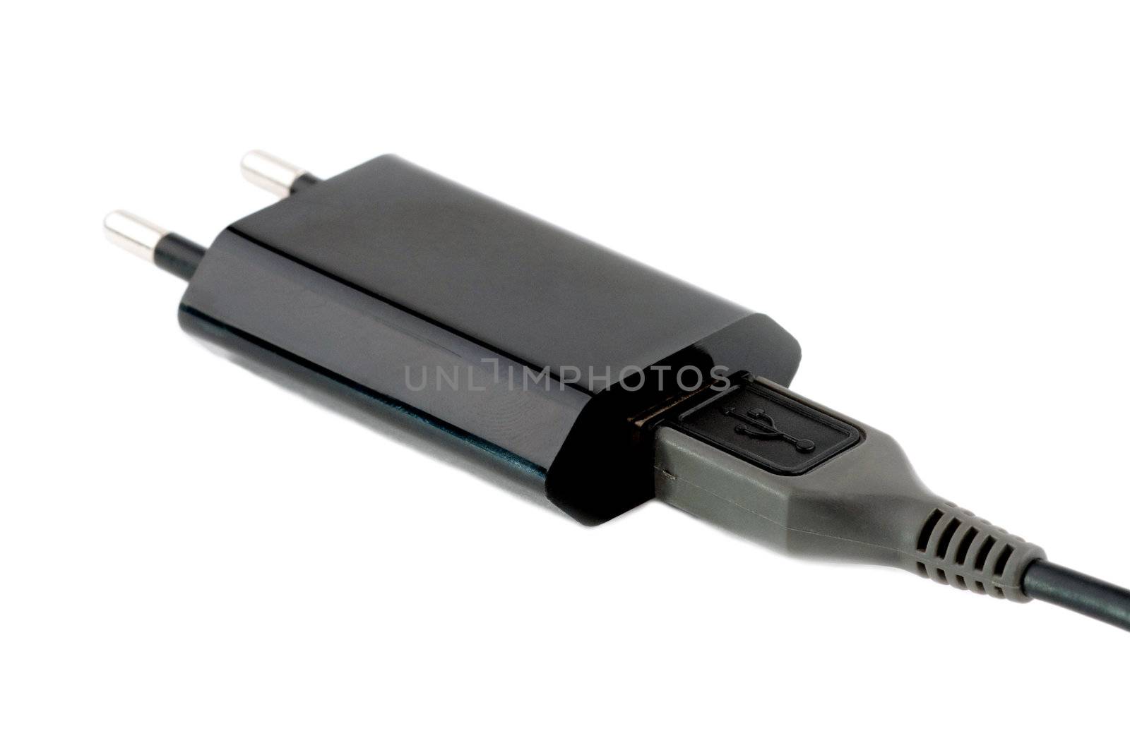 Black USB charger device with USB cable isolated on white