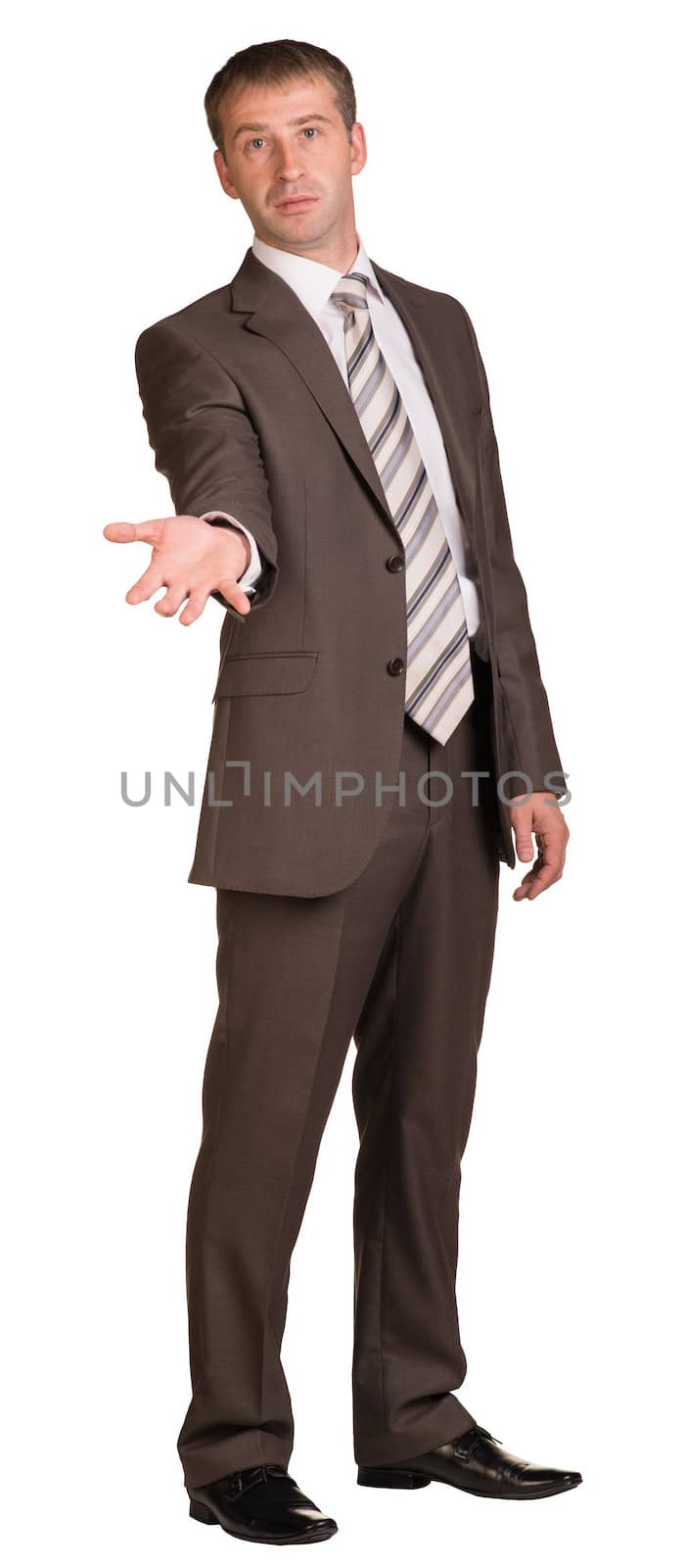 Businessman holding hand up in front of him. Isolated on white background.