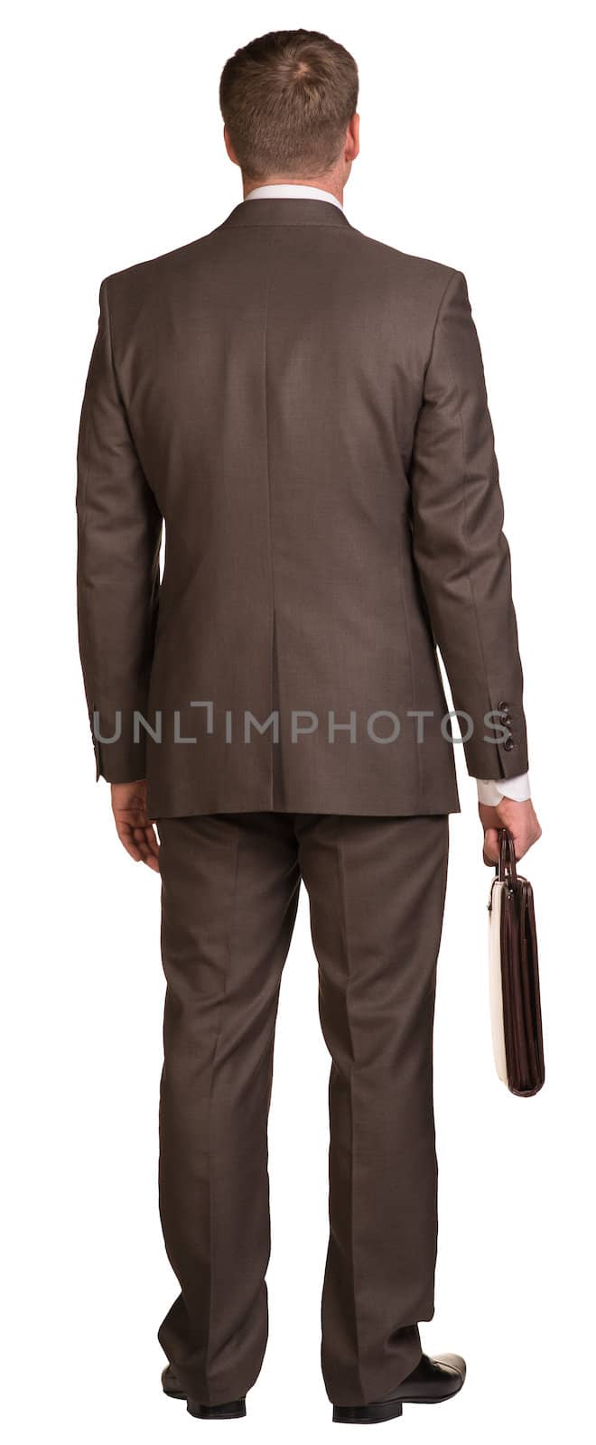 Standing businessman with briefcase. Rear view. Isolated on the white background.