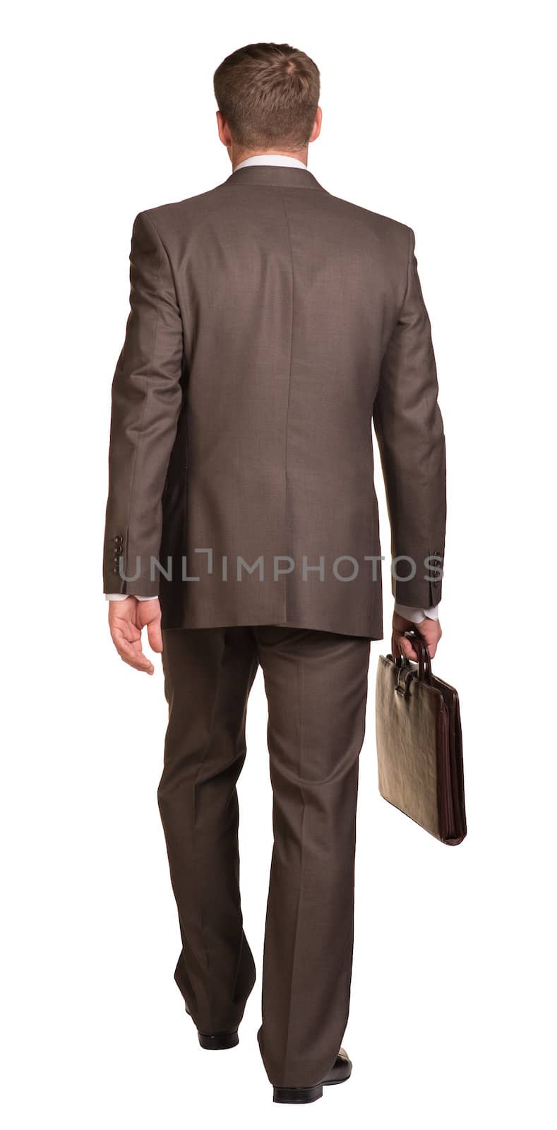 Walking businessman with briefcase. Rear view. Isolated on the white background.