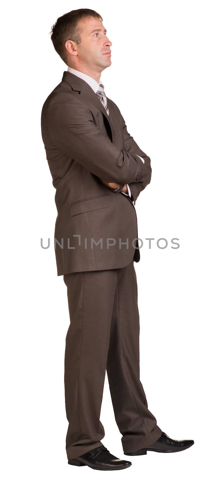 Businessman stands in half-turn by cherezoff
