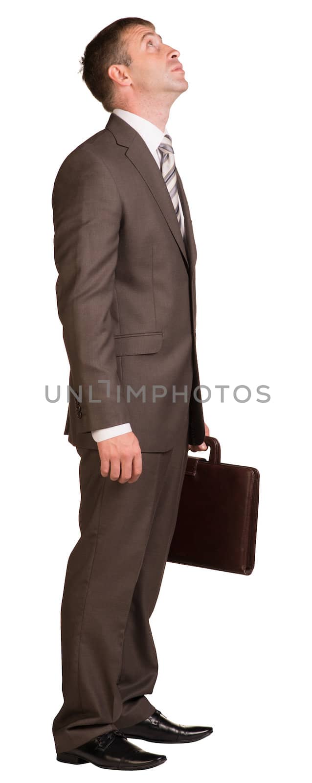 Businessman with briefcase looking up. Isolated on the white background.