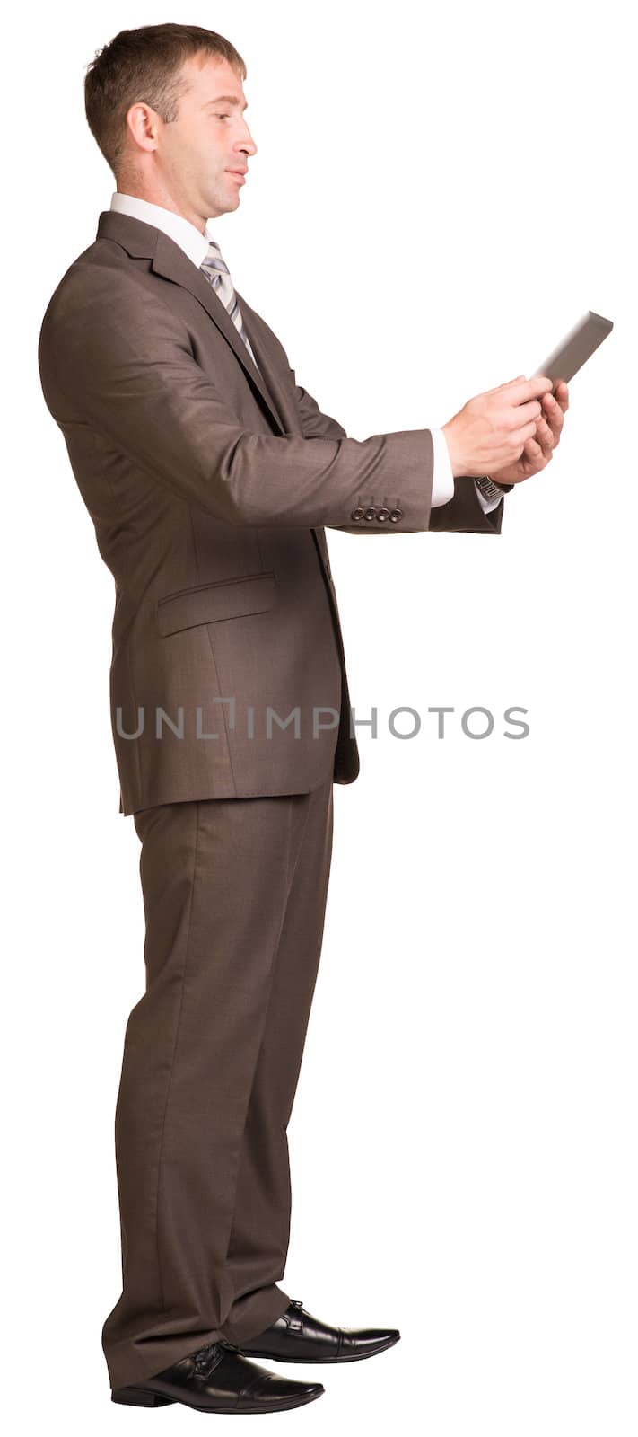 Businessman holding digital tablet by cherezoff