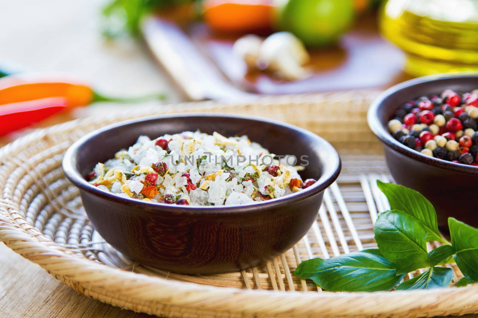 Sea salt with herbs and spices in a wood bowl