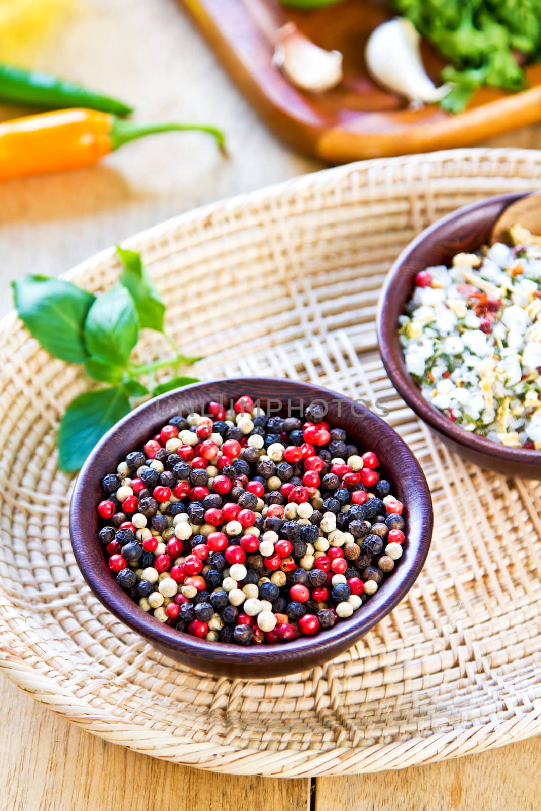 Colourful dried pepper in a wood bowl