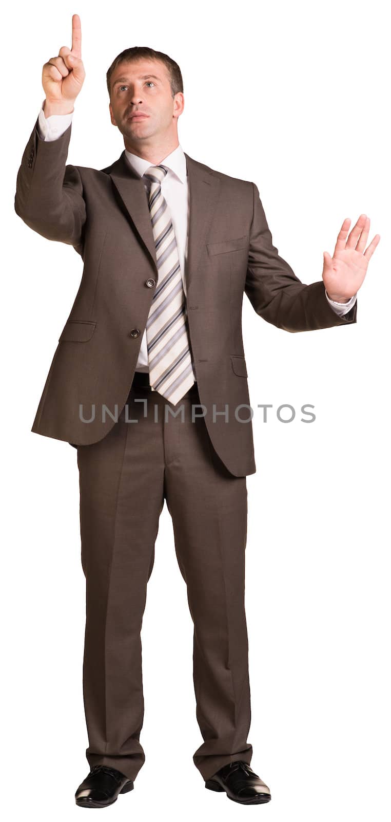 Businessman holding hands up in front of him by cherezoff