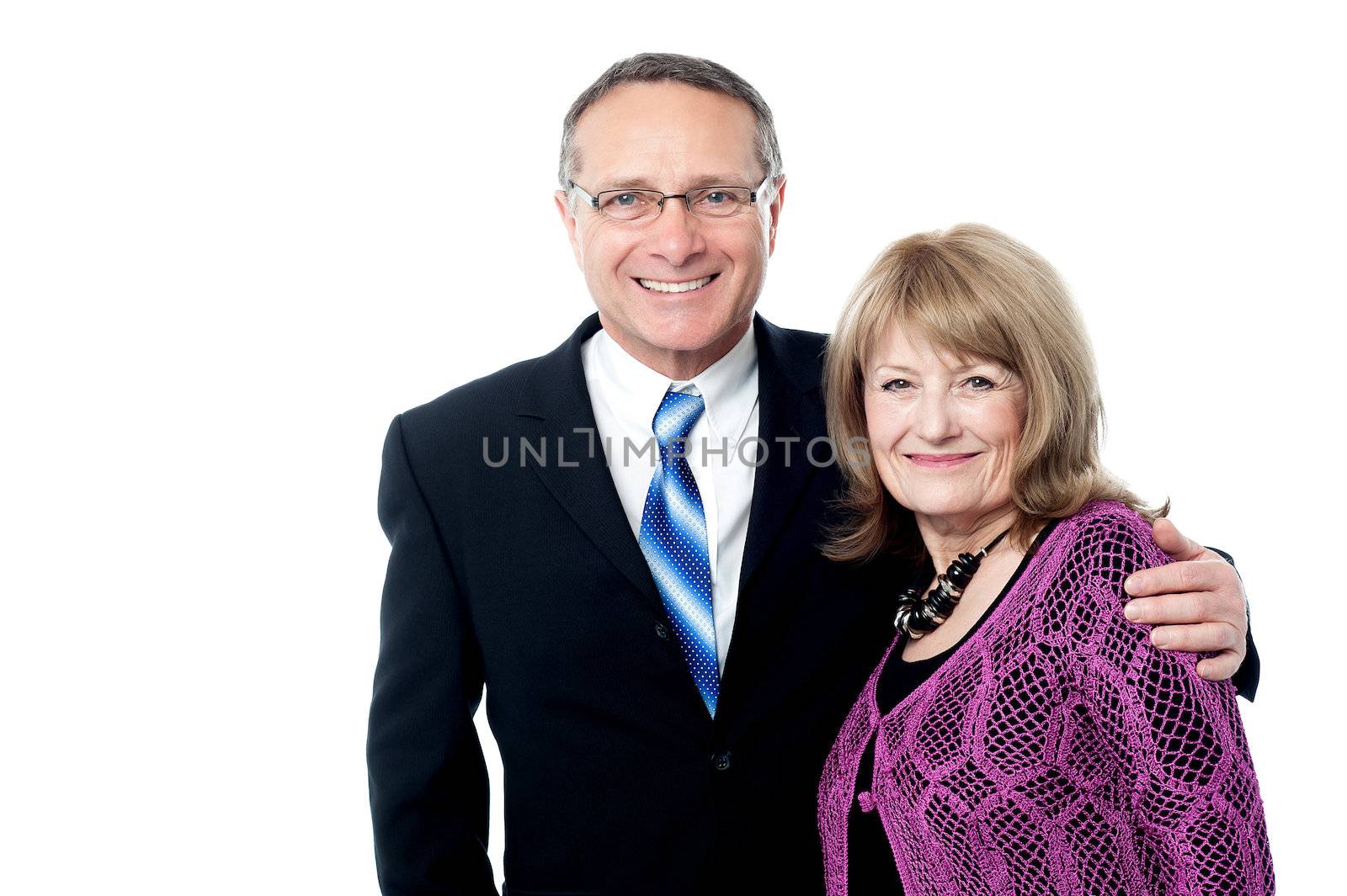 Smiling mature business couple by stockyimages