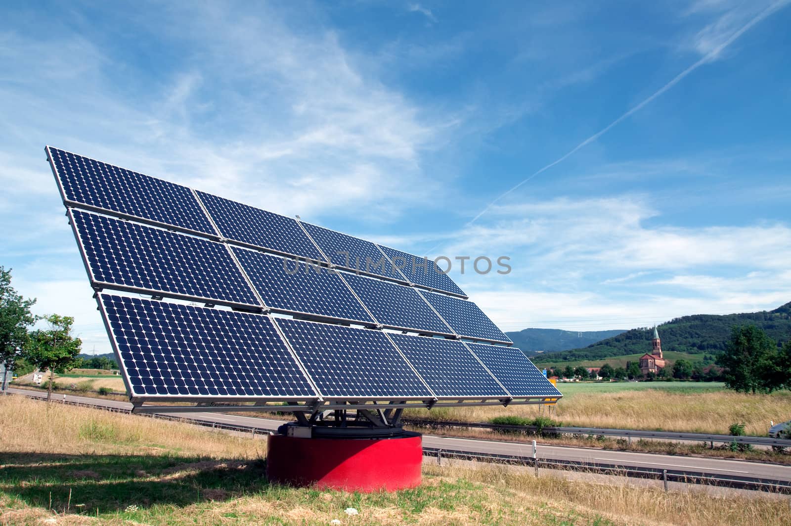 Solar panel against blue sky near the highway