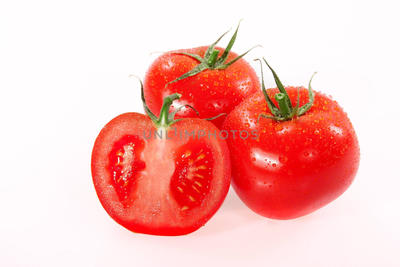 Red tomatos photo on the white background