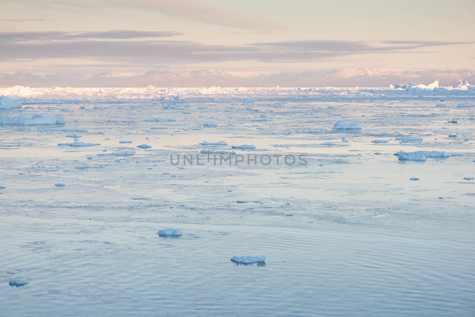 Arctic landscape in Greenland around Ilulissat with mountains and icebergs