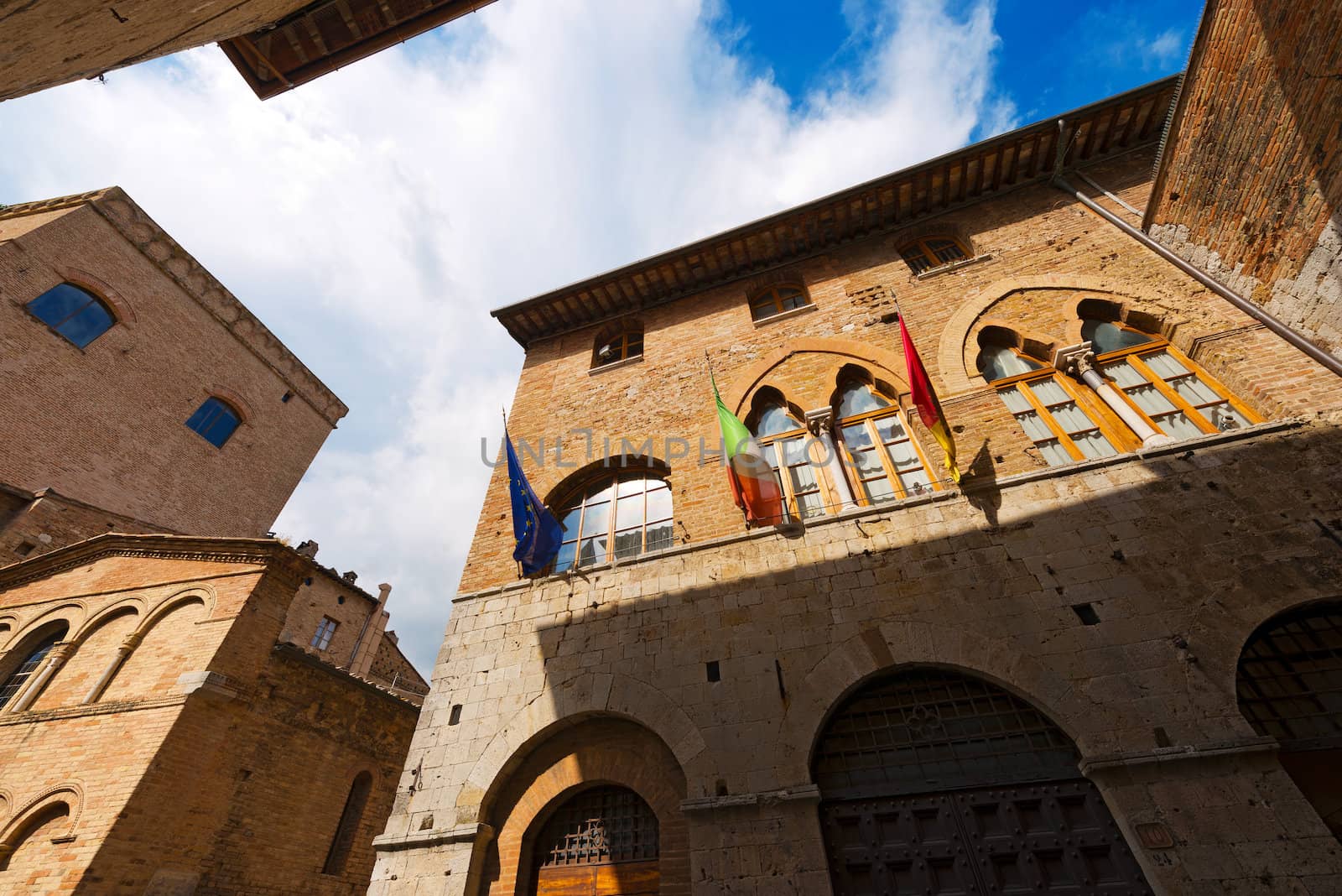 Old buildings and houses in San Gimignano medieval town (UNESCO heritage), Siena, Tuscany, Italy