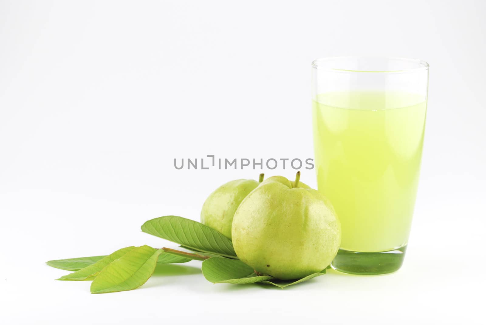 Guava and guava juice (tropical fruit) on white background  by teen00000