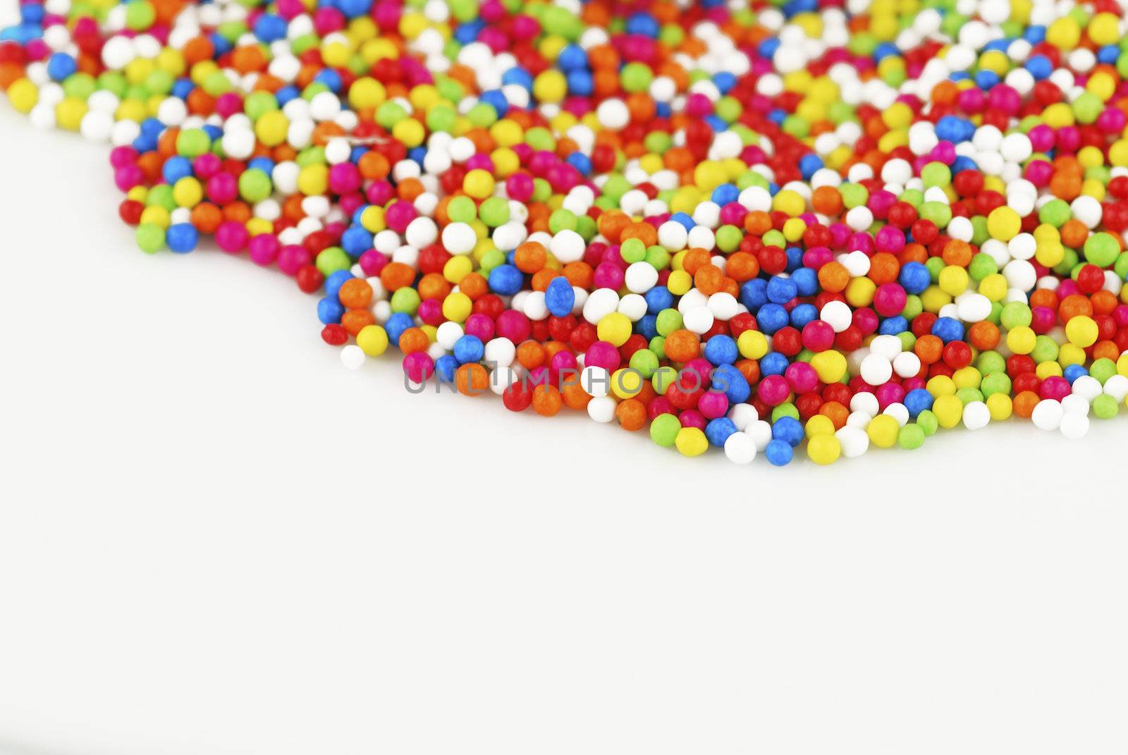 Colorful candy confetti on the white background