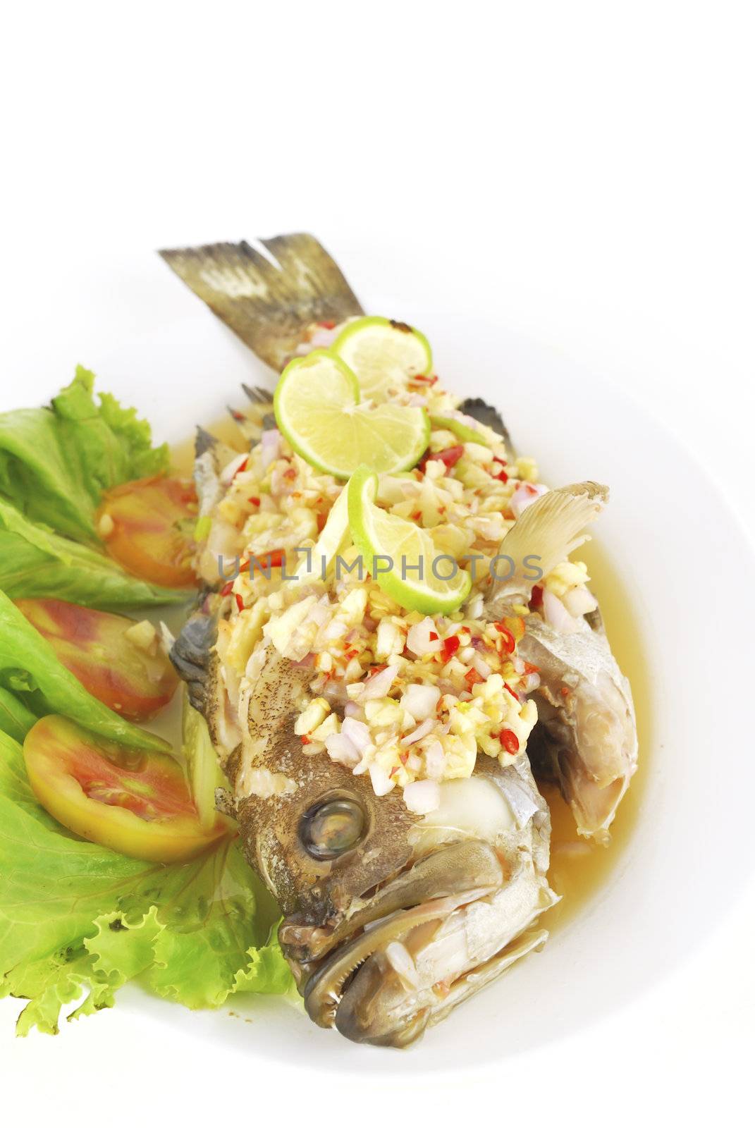 steamed sea bass with red chili / ingredient include garlic,ginger and light soy sauce.