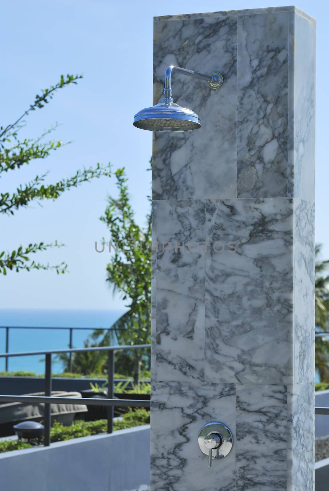 Outdoor shower at swimming pool and beach. The place you get clean after a nice day on the beach.