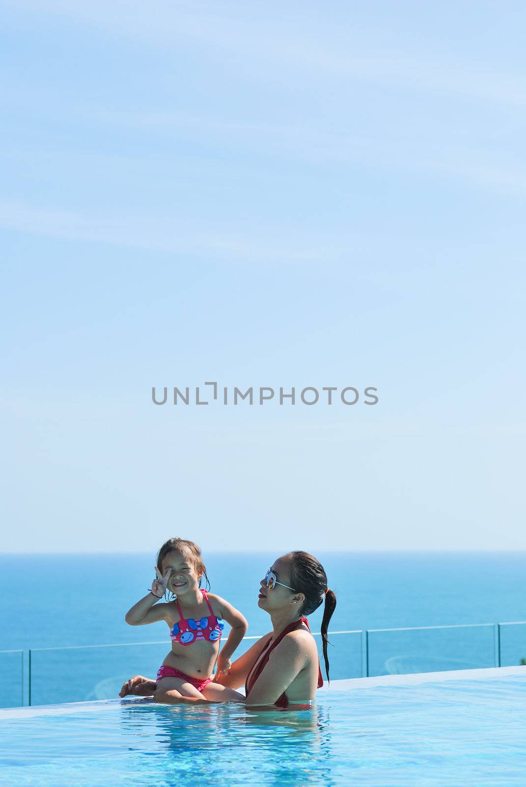 Summer vacations concept. Happy mother and daughter playing in b by teen00000