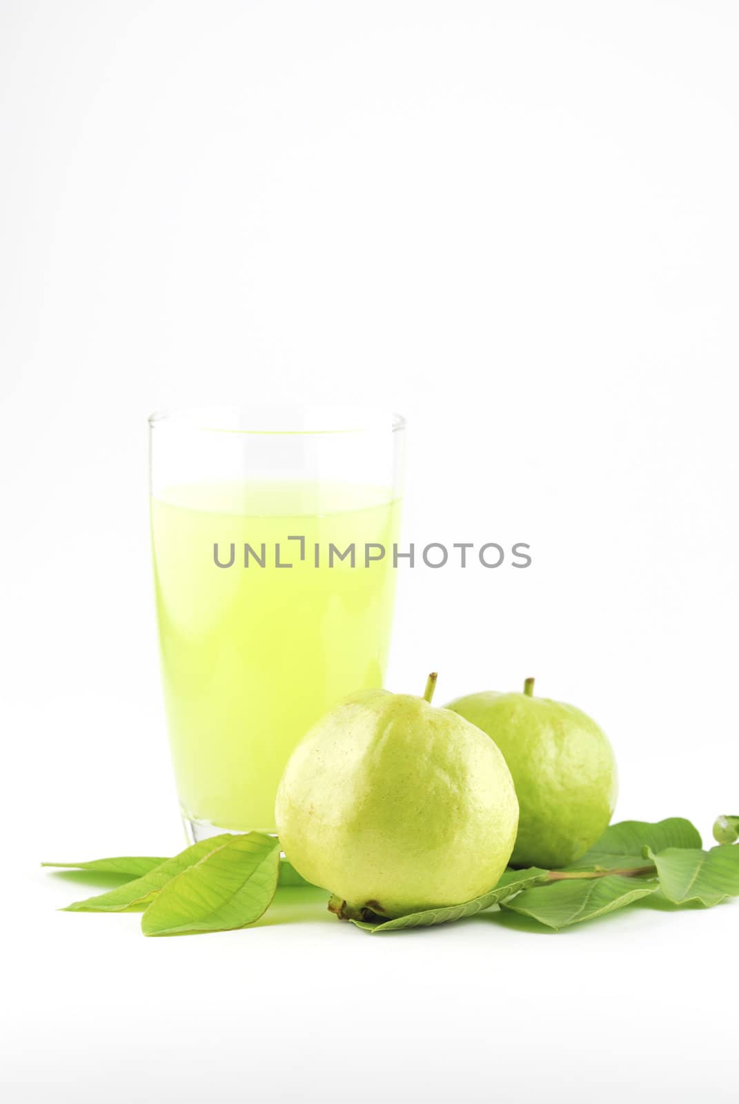 Guava and guava juice (tropical fruit) on white background