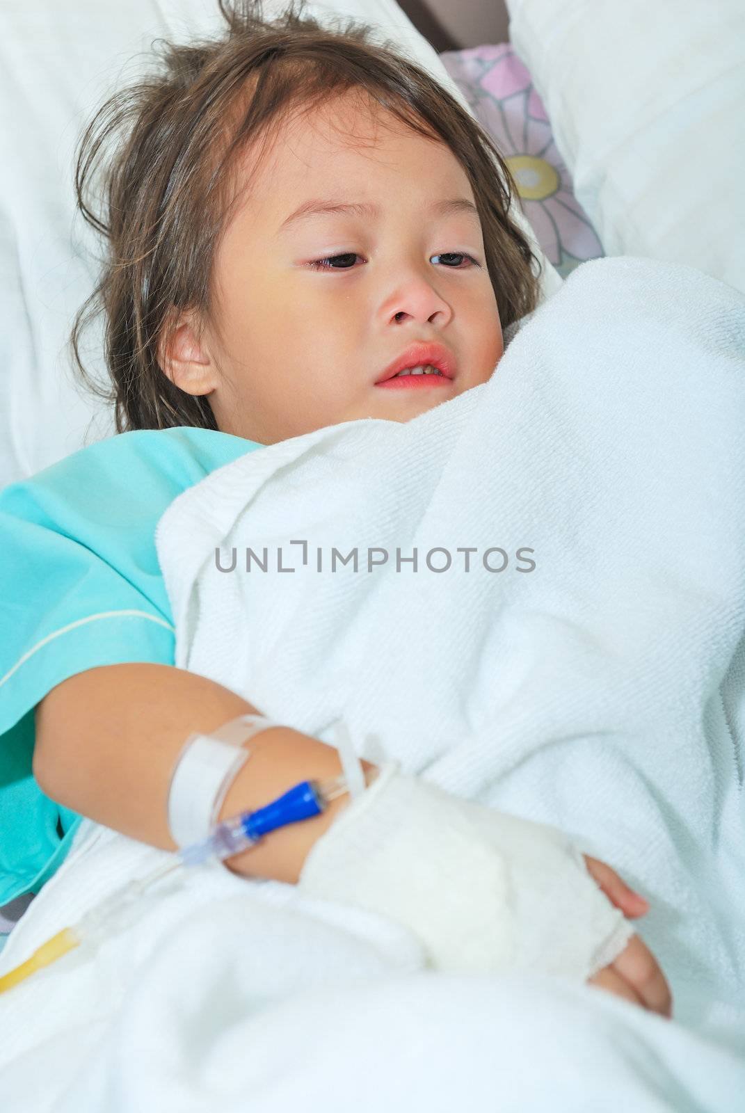 Sick little girl crying in hospital bed by teen00000