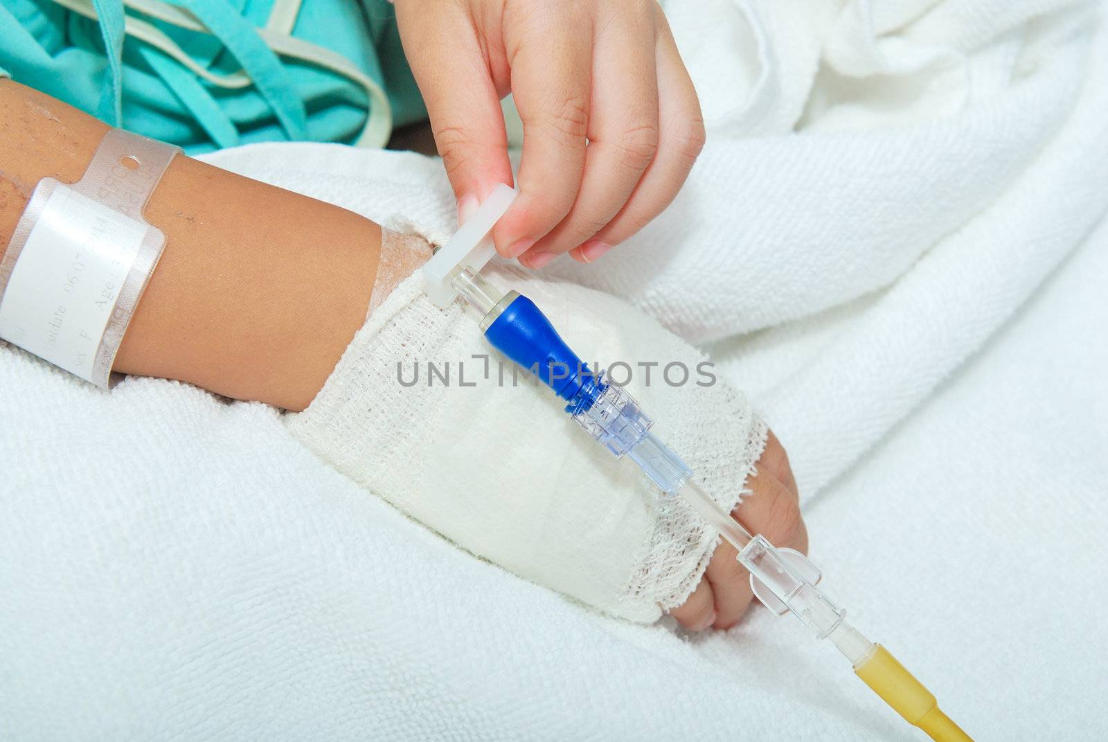 Hand of sick little girl at hospital