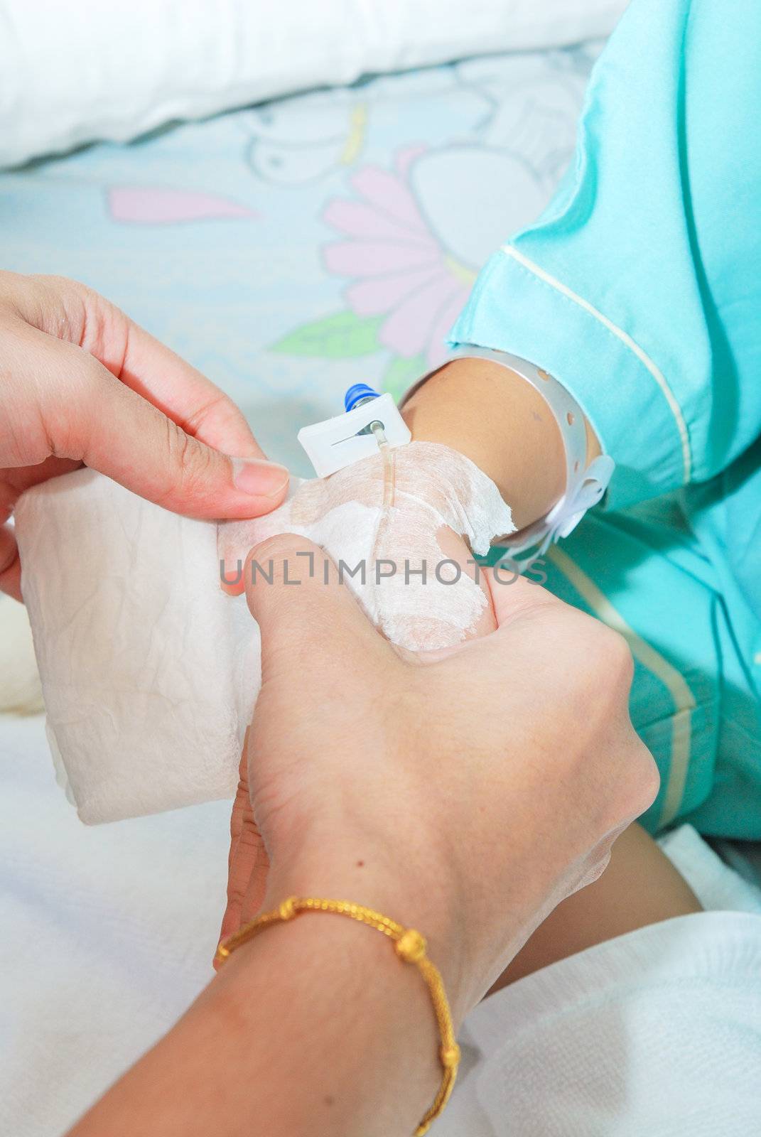 Hand of sick little girl at hospital