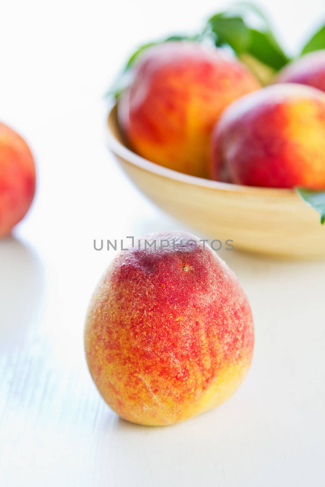 Fresh Peachs in a wood bowl