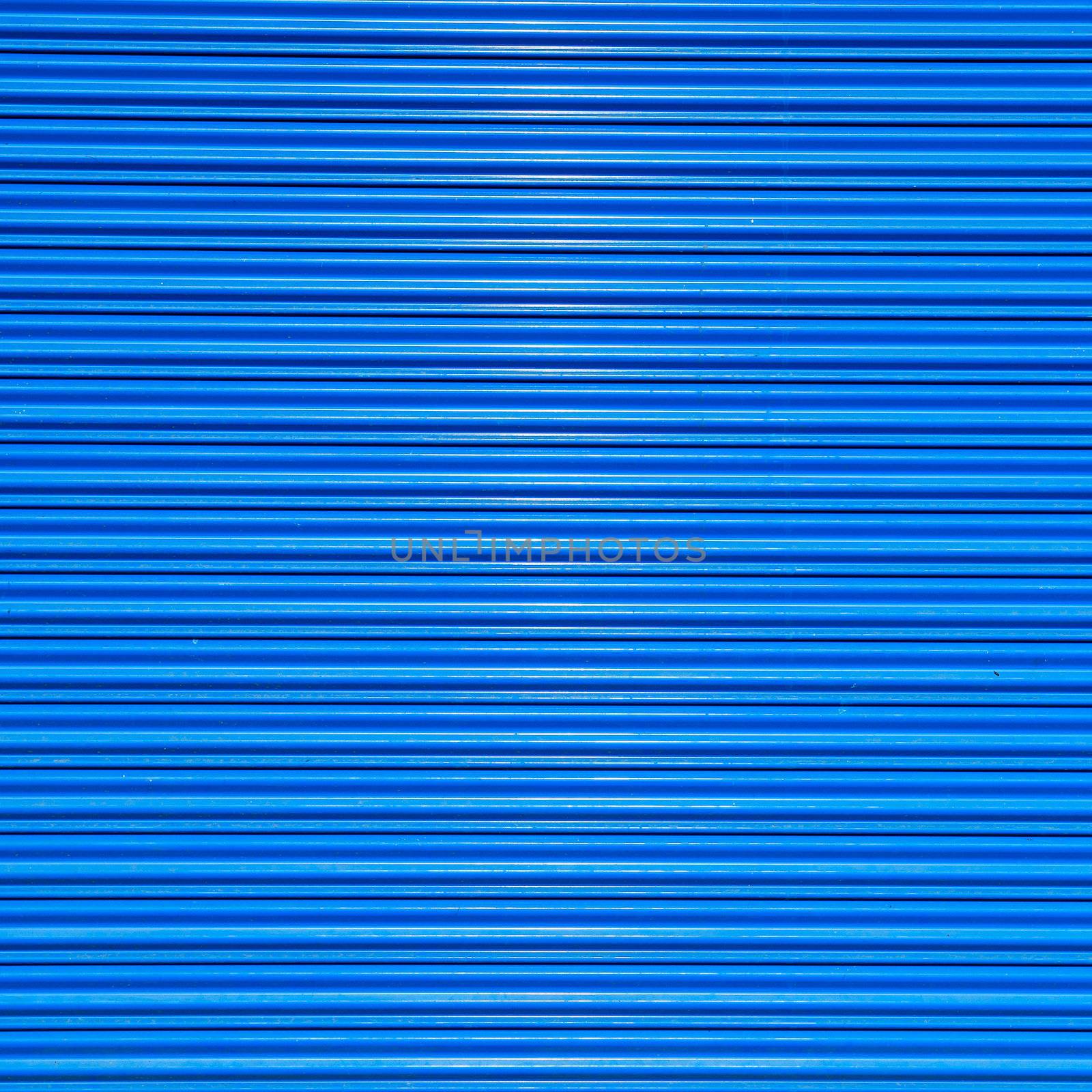 a shuttered roll up metal blue door