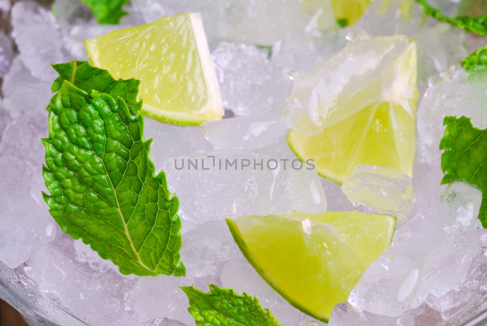 Mojito , lime pieces , leaves of mint with ice and rum