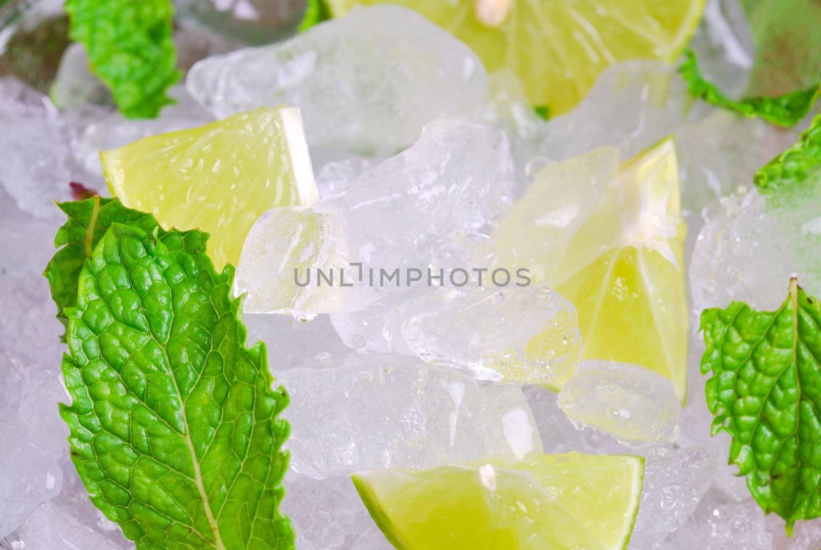 Mojito , lime pieces , leaves of mint with ice and rum