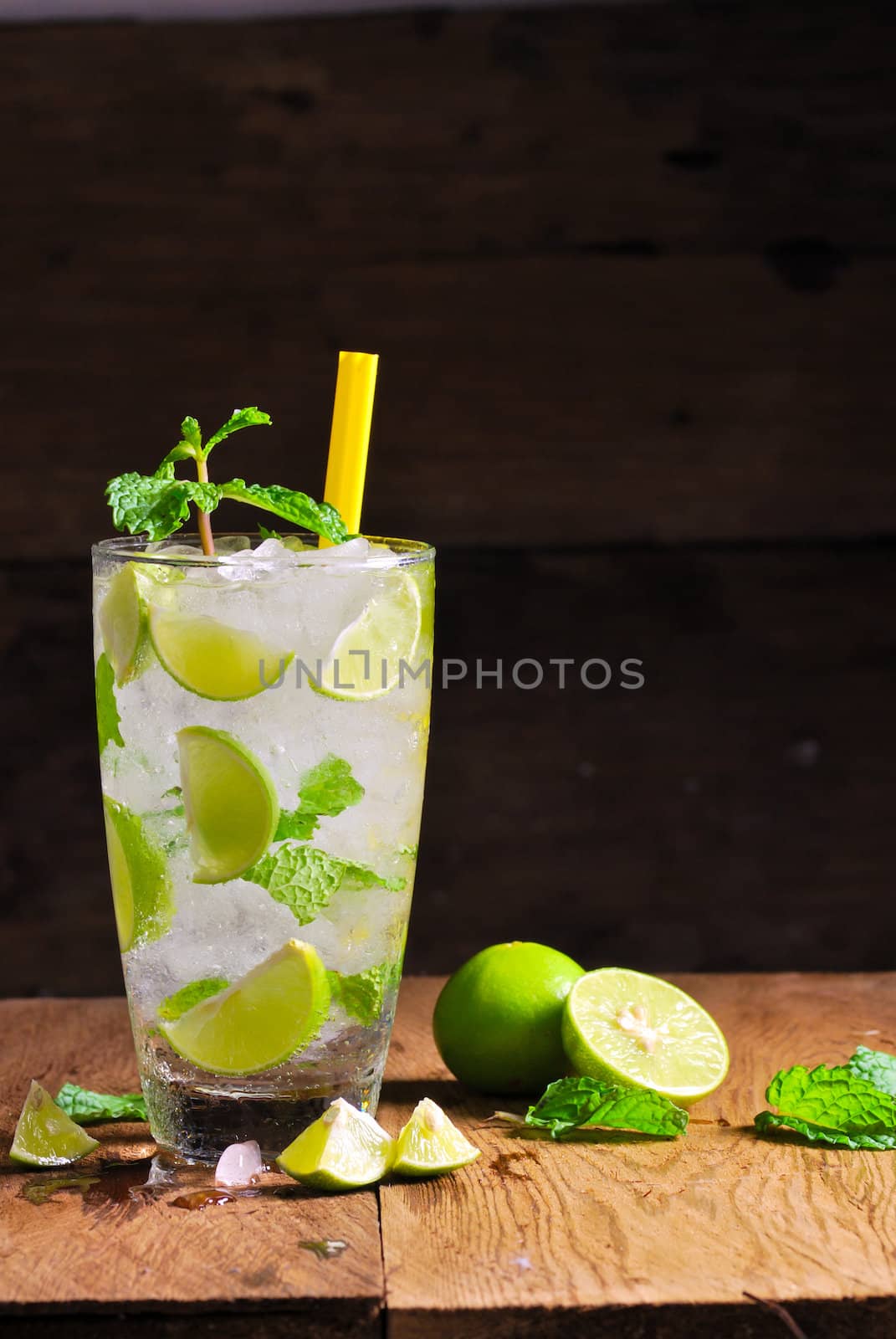 Mojito , lime pieces , leaves of mint with ice and rum