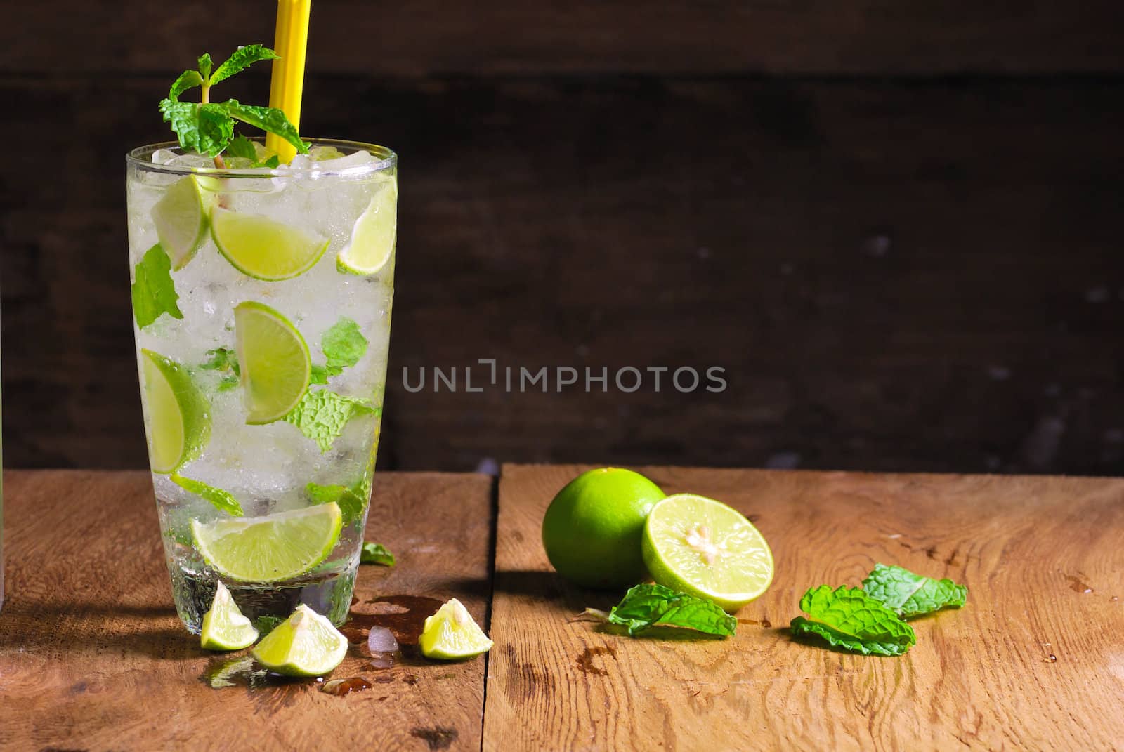 Mojito , lime pieces , leaves of mint with ice and rum