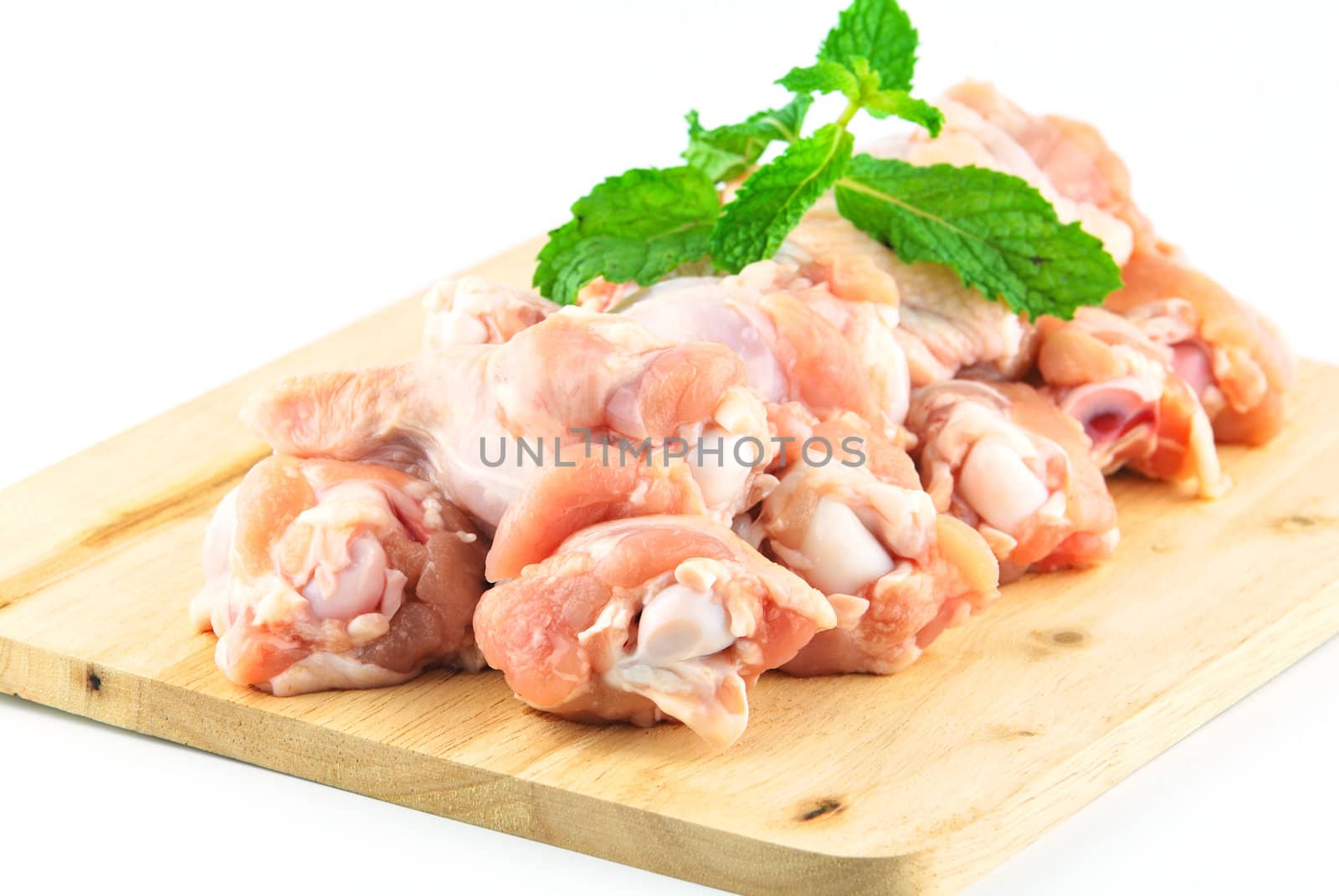 Chicken wing meat on chop board