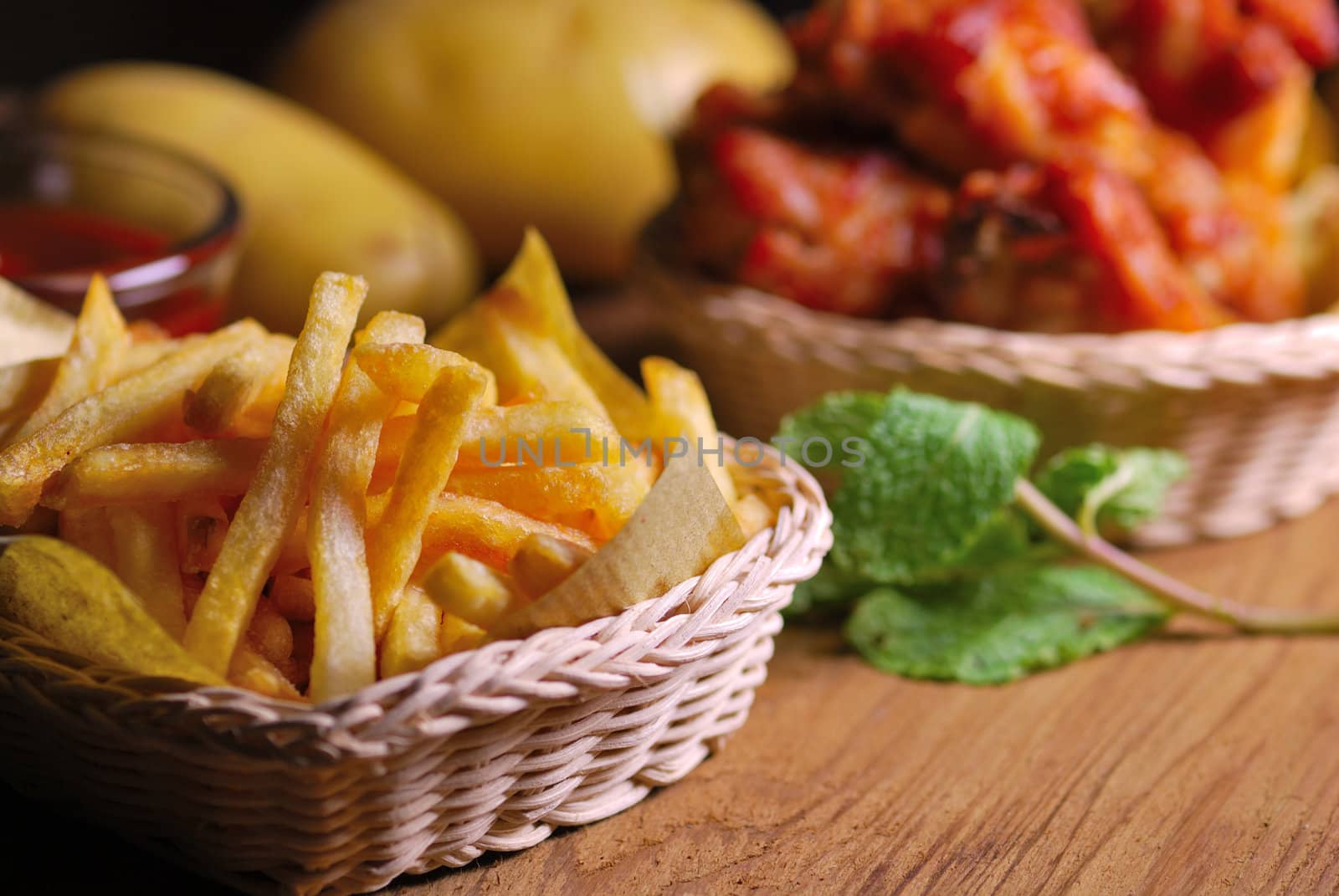 fried chicken wings with french fries and ketchup