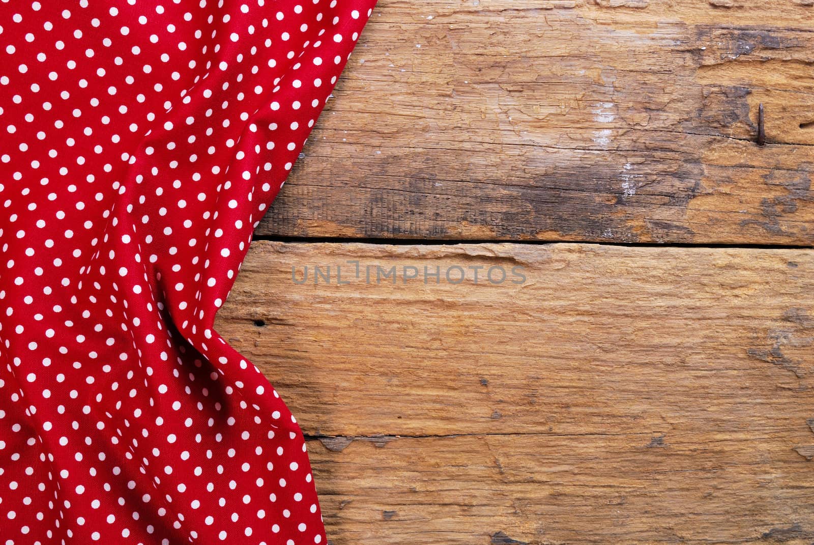 the background made from checkered napkin on old wooden table