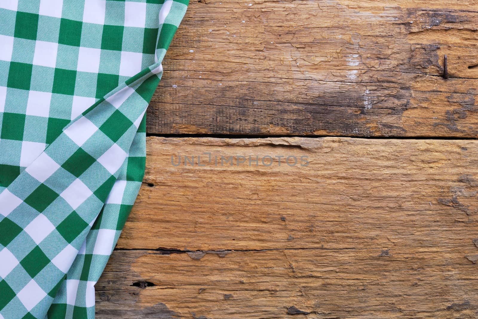 the background made from checkered napkin on old wooden table by teen00000