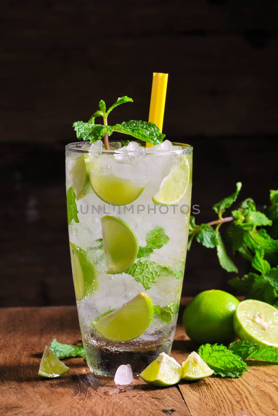 Mojito , lime pieces , leaves of mint with ice and rum