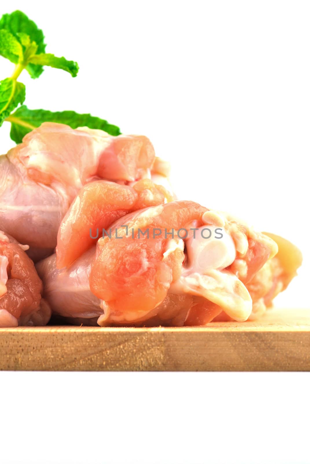 Chicken wing meat on chop board by teen00000