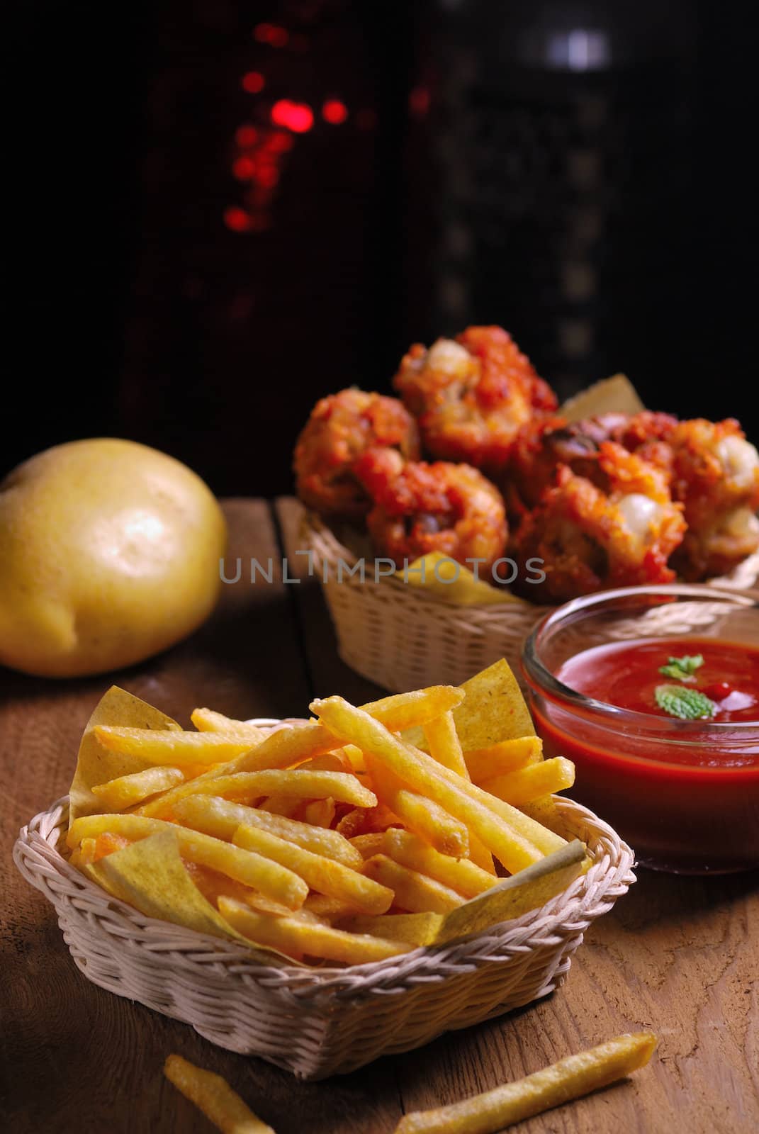 fried chicken wings with french fries and ketchup