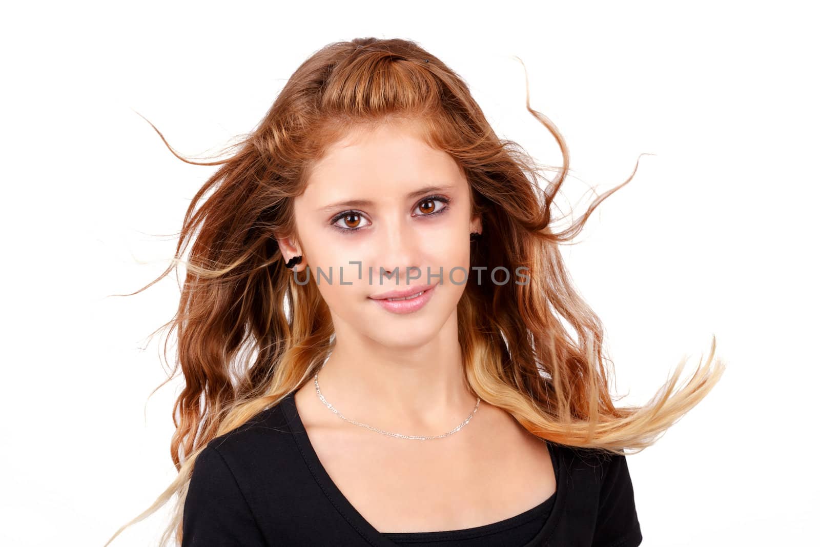 Studio fashion portrait of young beautiful smiling girl with nice eyes on white background