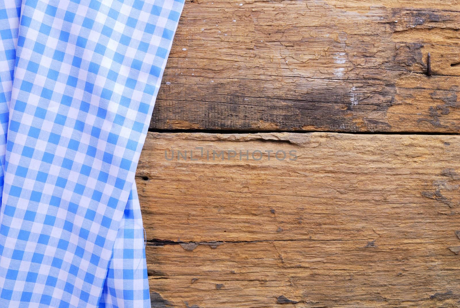 the background made from checkered napkin on old wooden table