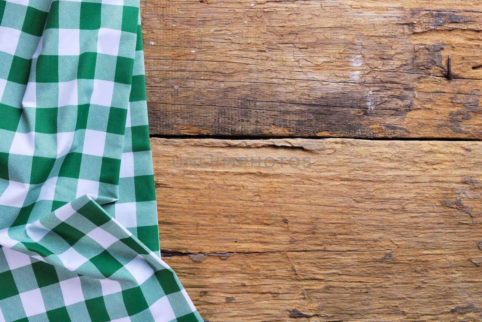 the background made from checkered napkin on old wooden table