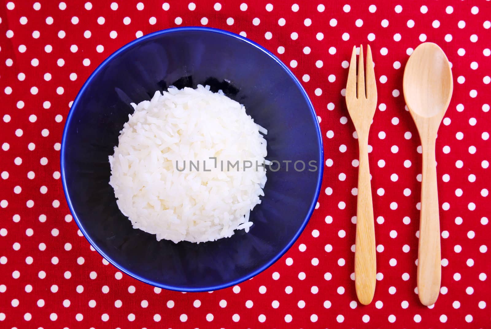 Thai jasmine cooked rice on blue plate